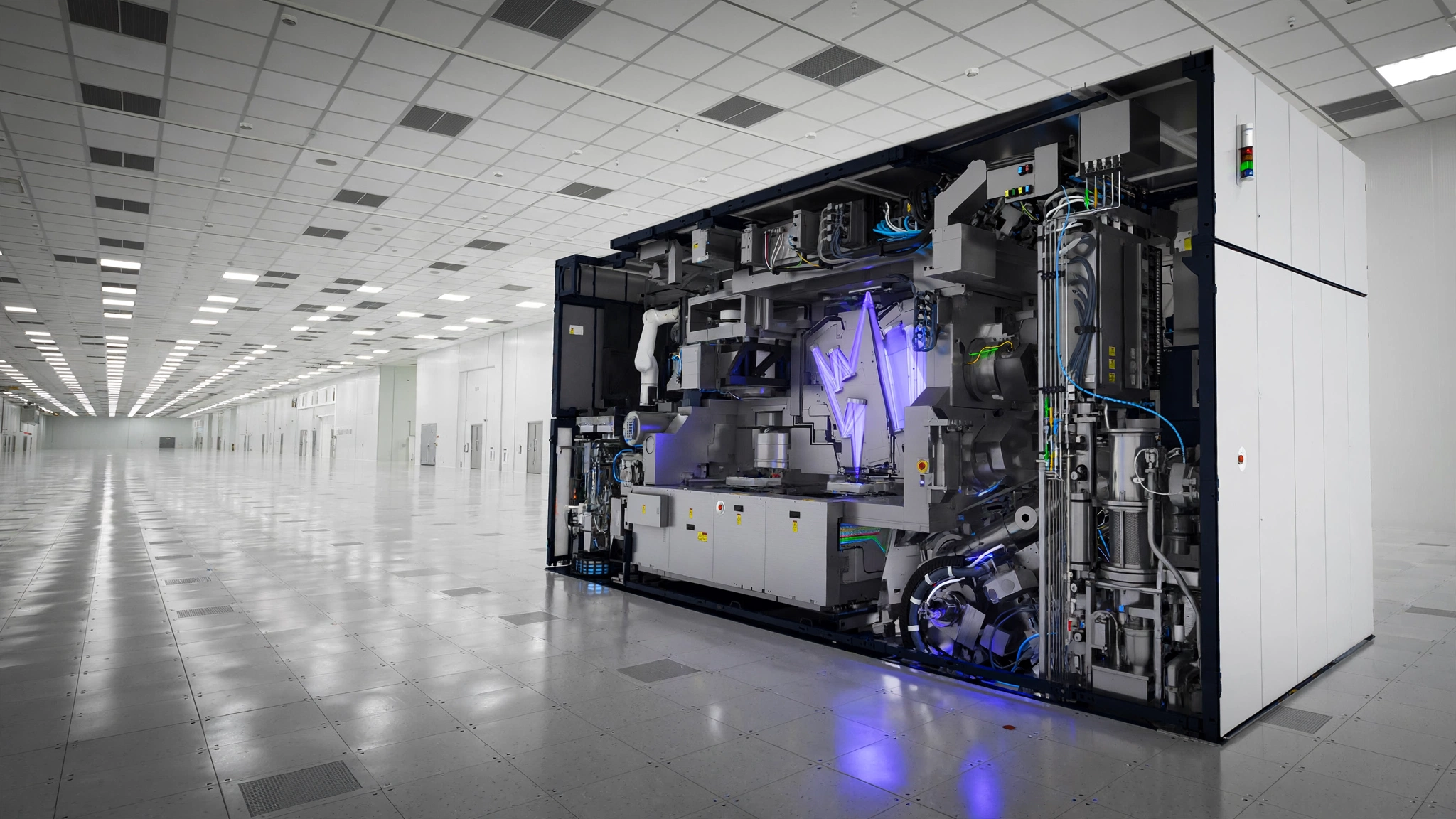 A single EUV lithography machine in a cleanroom, its chamber glowing faintly, surrounded by empty fab floor stretching in every direction